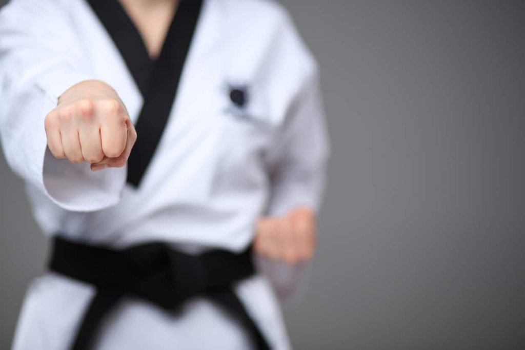 black karate belt tied across someone's waist